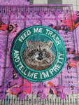 Feed Me Trash Raccoon Iron On Patch